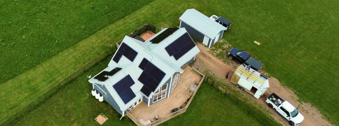 Complete commercial solar solution in PEI featuring panels on both the primary commercial and a detached garage for total energy independence.