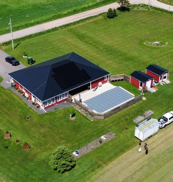 Modern coastal PEI property featuring a integrated solar and battery storage system for storm resilience and reliable backup power.